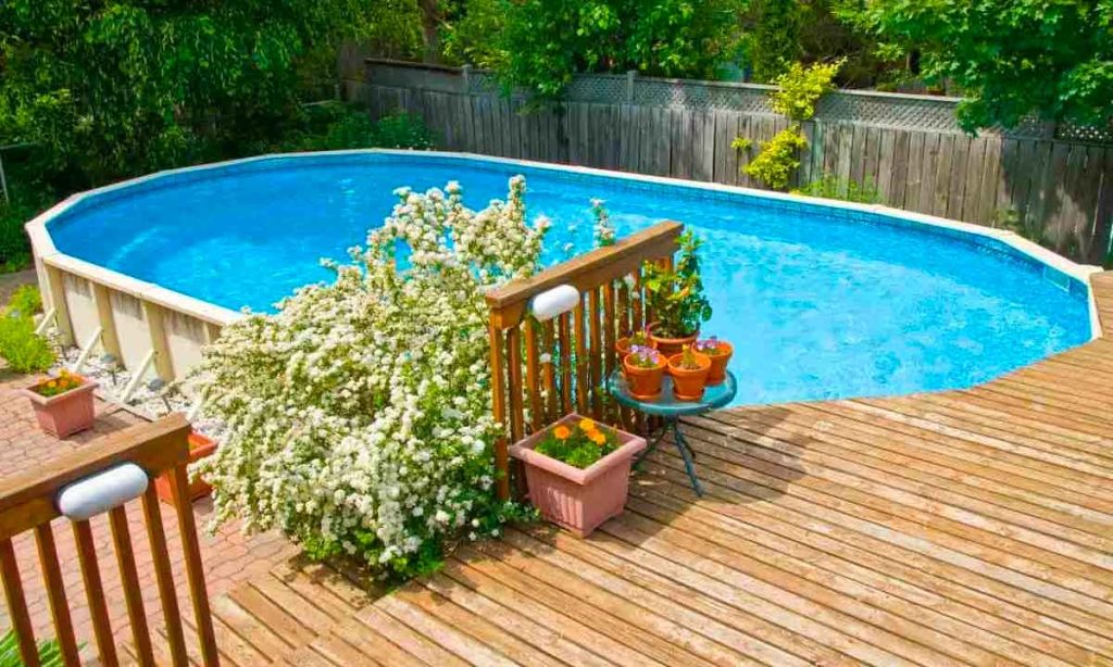 A deck for your above-ground pool is an added cost but one most homeowners want for a finished look.