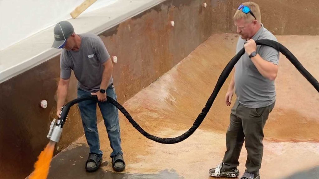 Pool contractor being trained on applying ecoFINISH by on-site trainer, Cory Anderson.