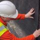 Pool Contractor Using Drainage Mat During Pool Construction